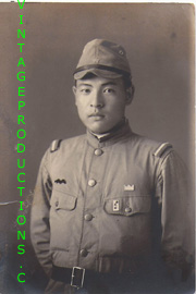 Japanese Army NCO With Squadron marking, Branch Line and a crown shaped patch over his left pocket Photo